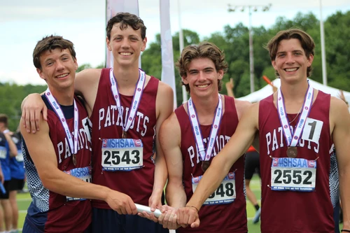 Grpup of boys team smiling.